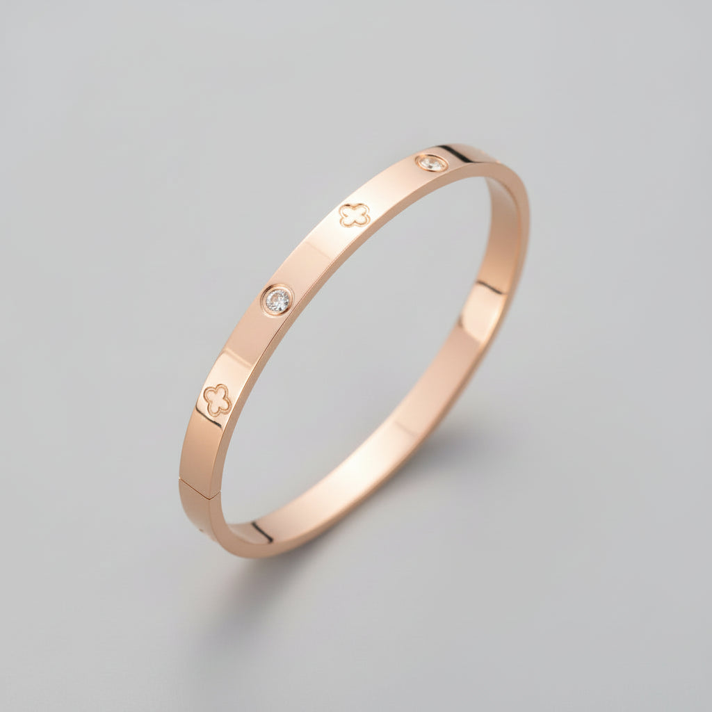 Rose gold bracelet with diamond accents on a light surface